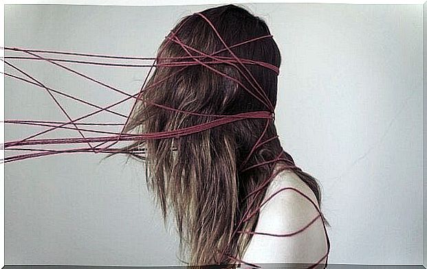 woman tangled up in yarn