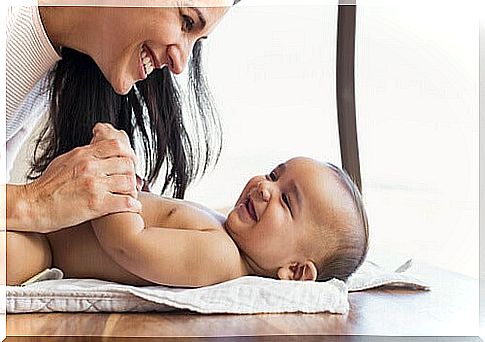 mother playing with her baby