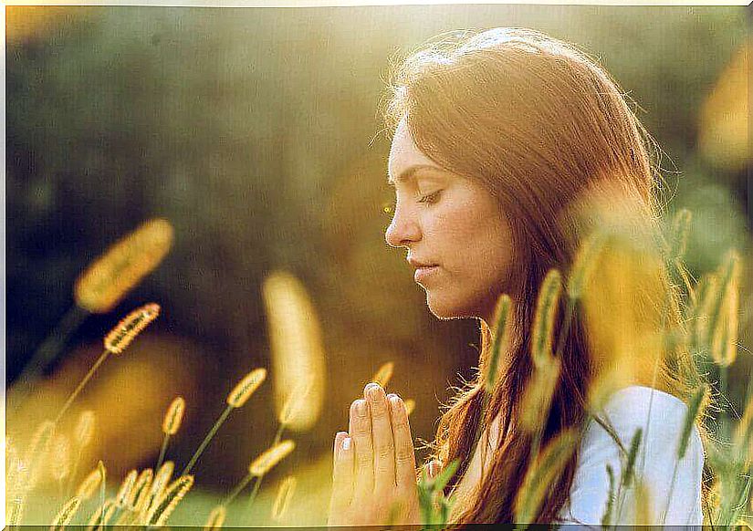 woman meditating in nature