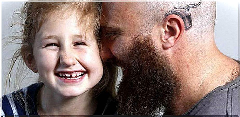 father-with-implant-cochlear-tattooed