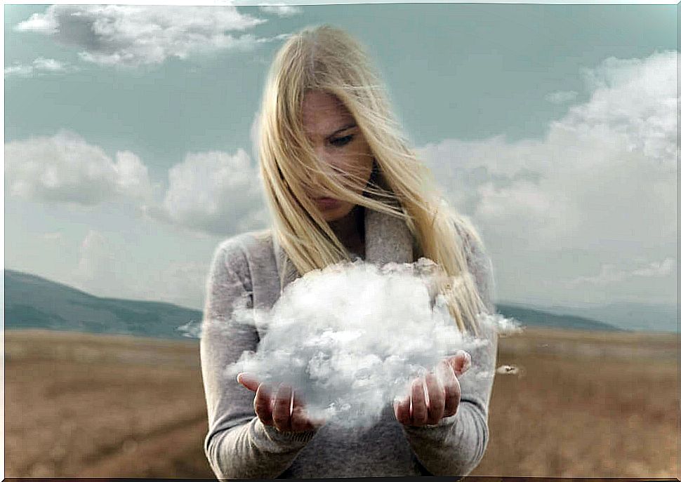 woman holding cloud in hands