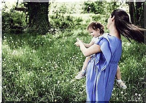 woman holding her child on her lap