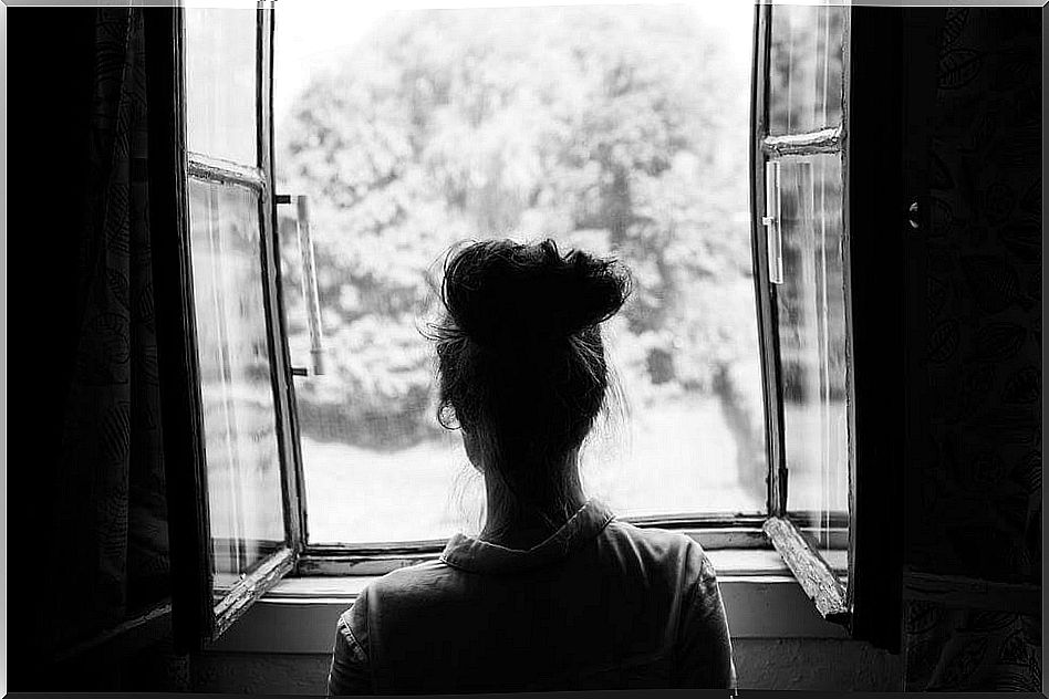 woman looking out the window