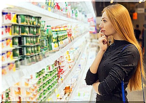 woman in doubt at the supermarket