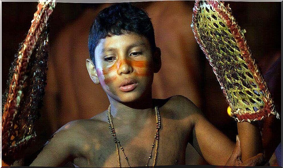 Indigenous child participating in ritual