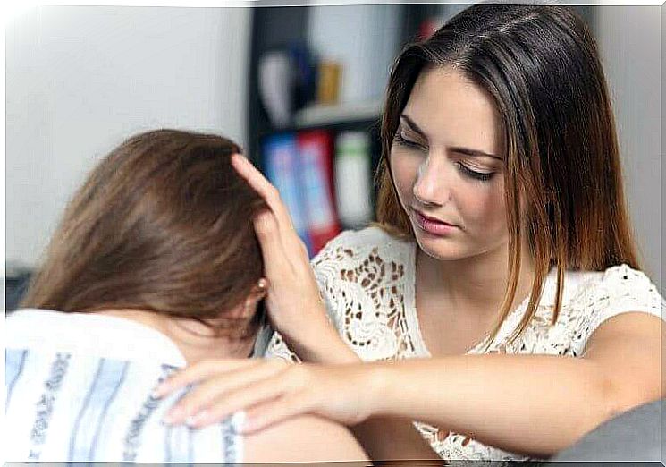 Woman receiving support from a friend