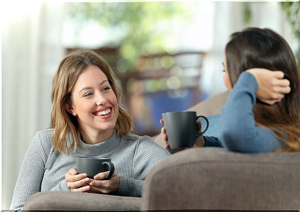 Friends chatting and drinking coffee